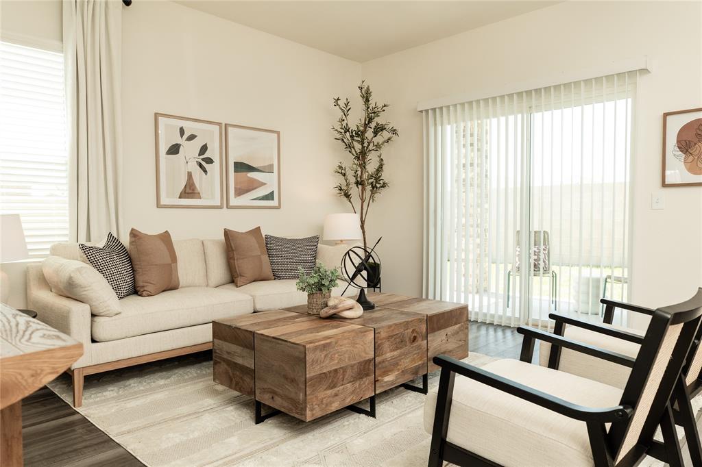 a living room with furniture and a window