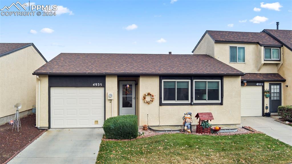 a front view of a house with yard