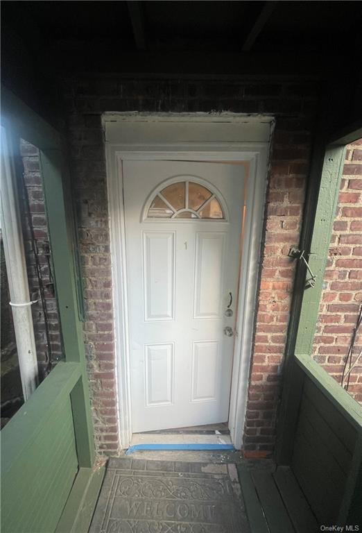 a view of room with window and hallway