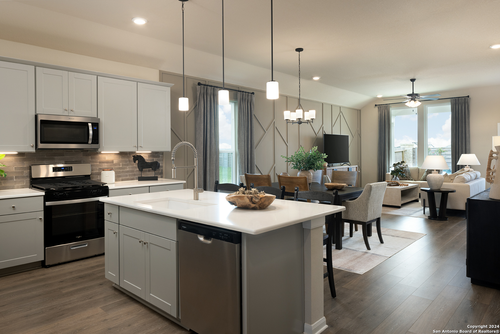 a kitchen with a sink stove and refrigerator