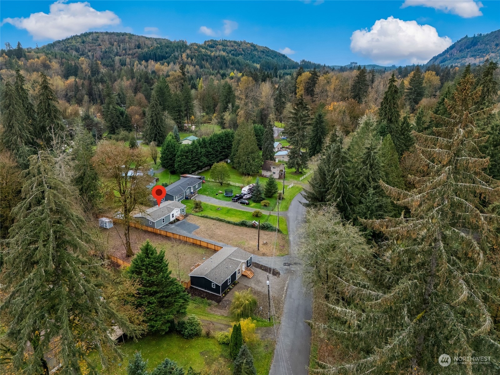 an aerial view of a house with a yard