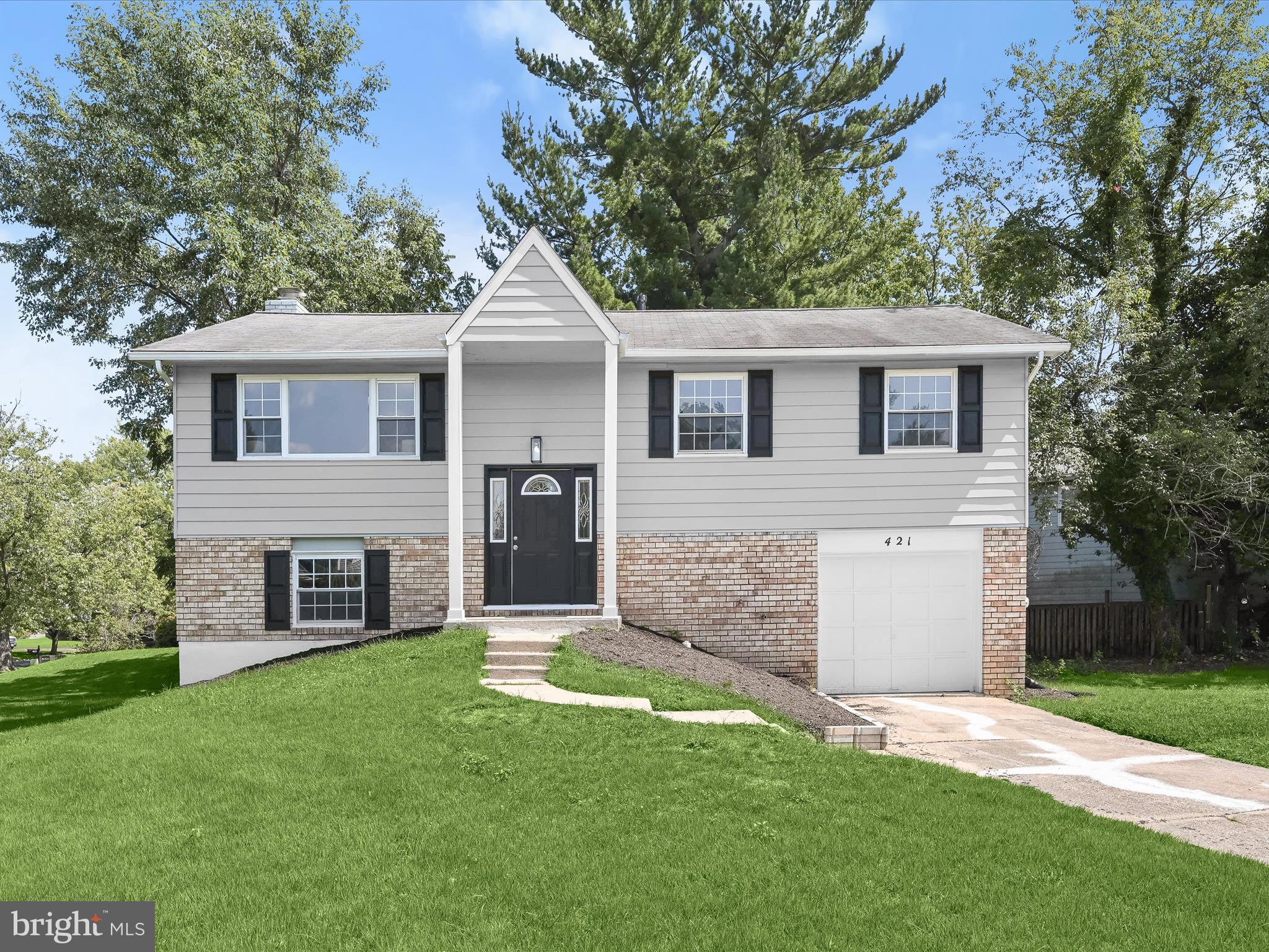 front view of a house with a yard