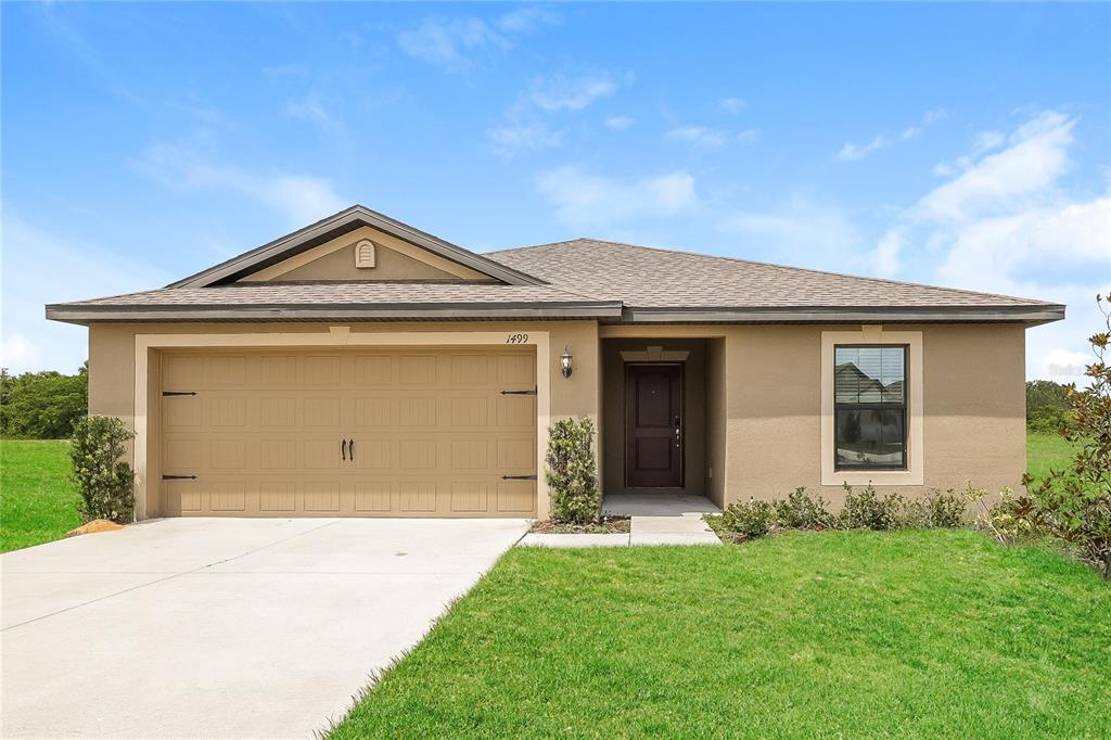 front view of a house with a yard