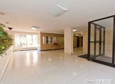 a view of a big room with closet and windows