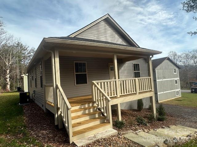 a view of a house with a small deck