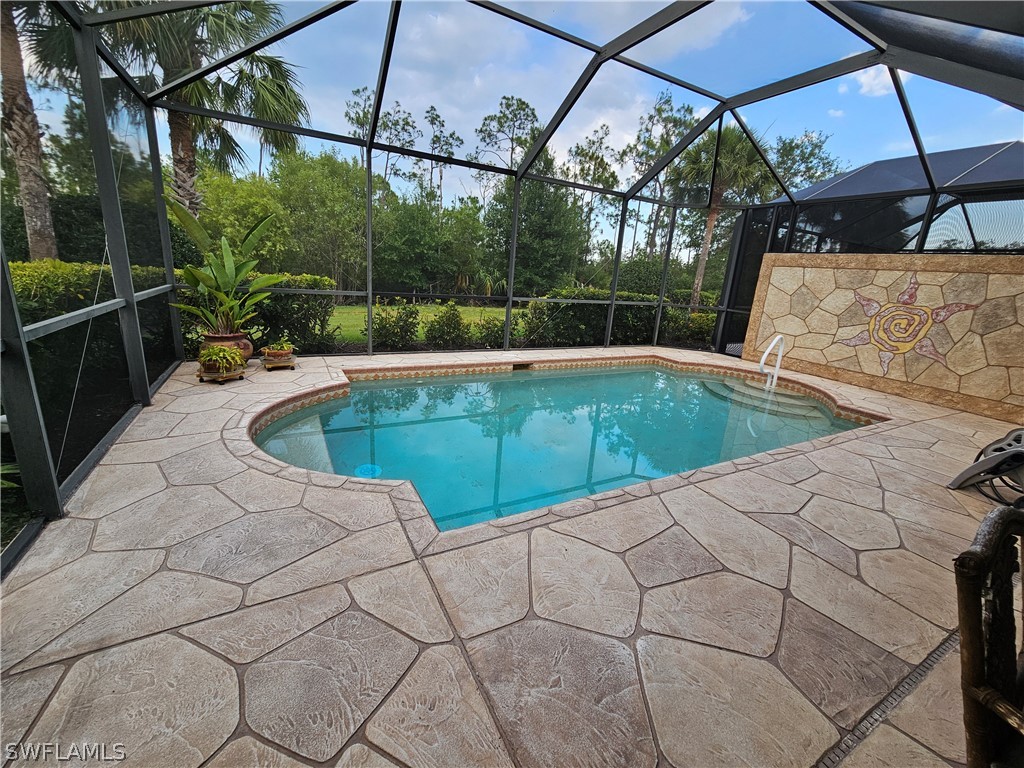 a view of a swimming pool with a patio