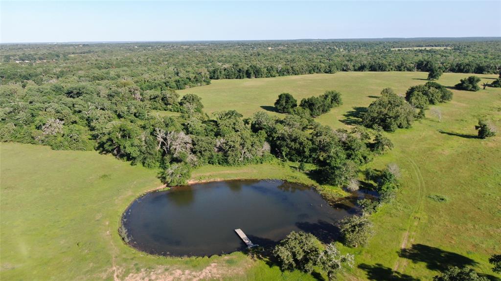 a view of a lake with a yard