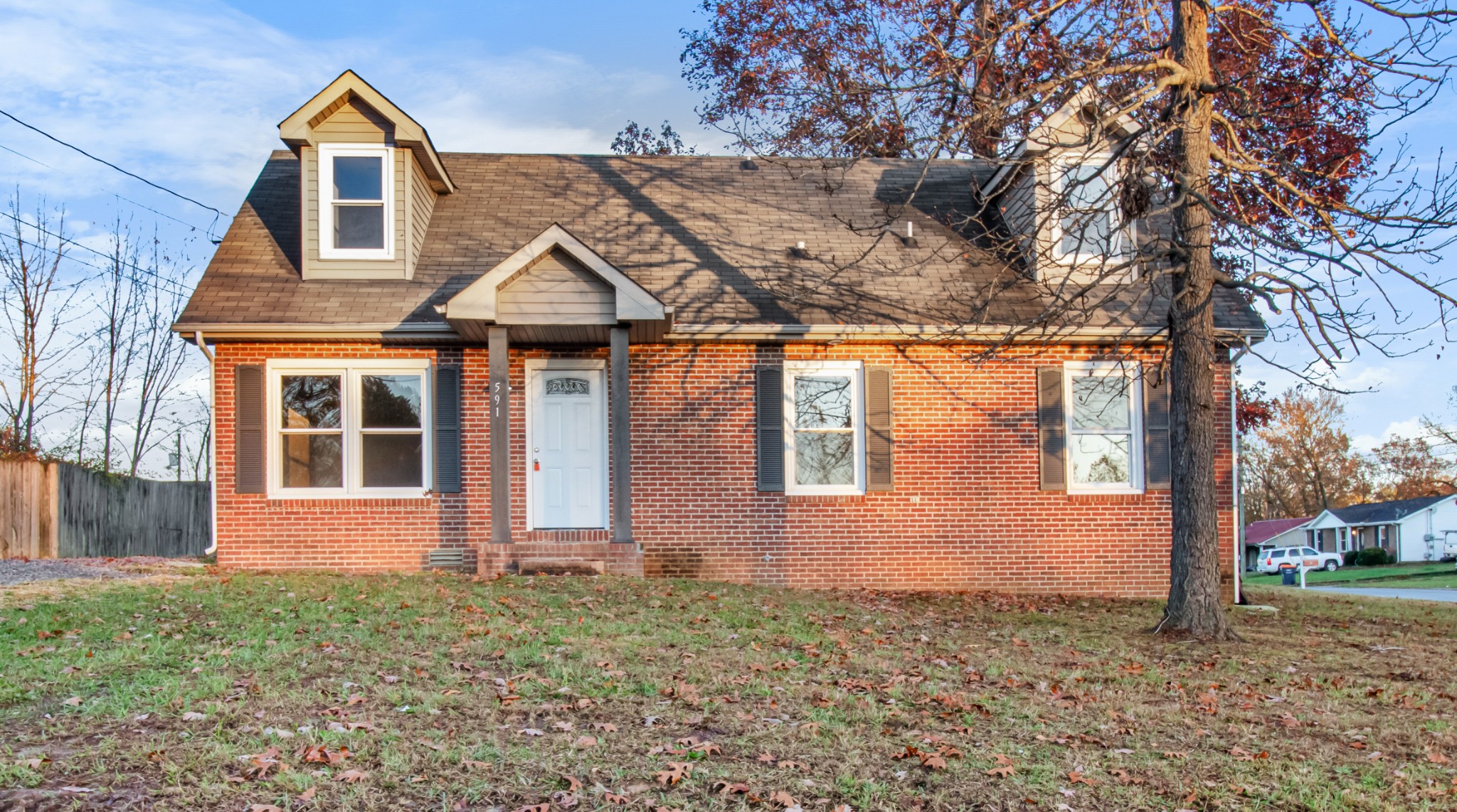 front view of a house with a yard