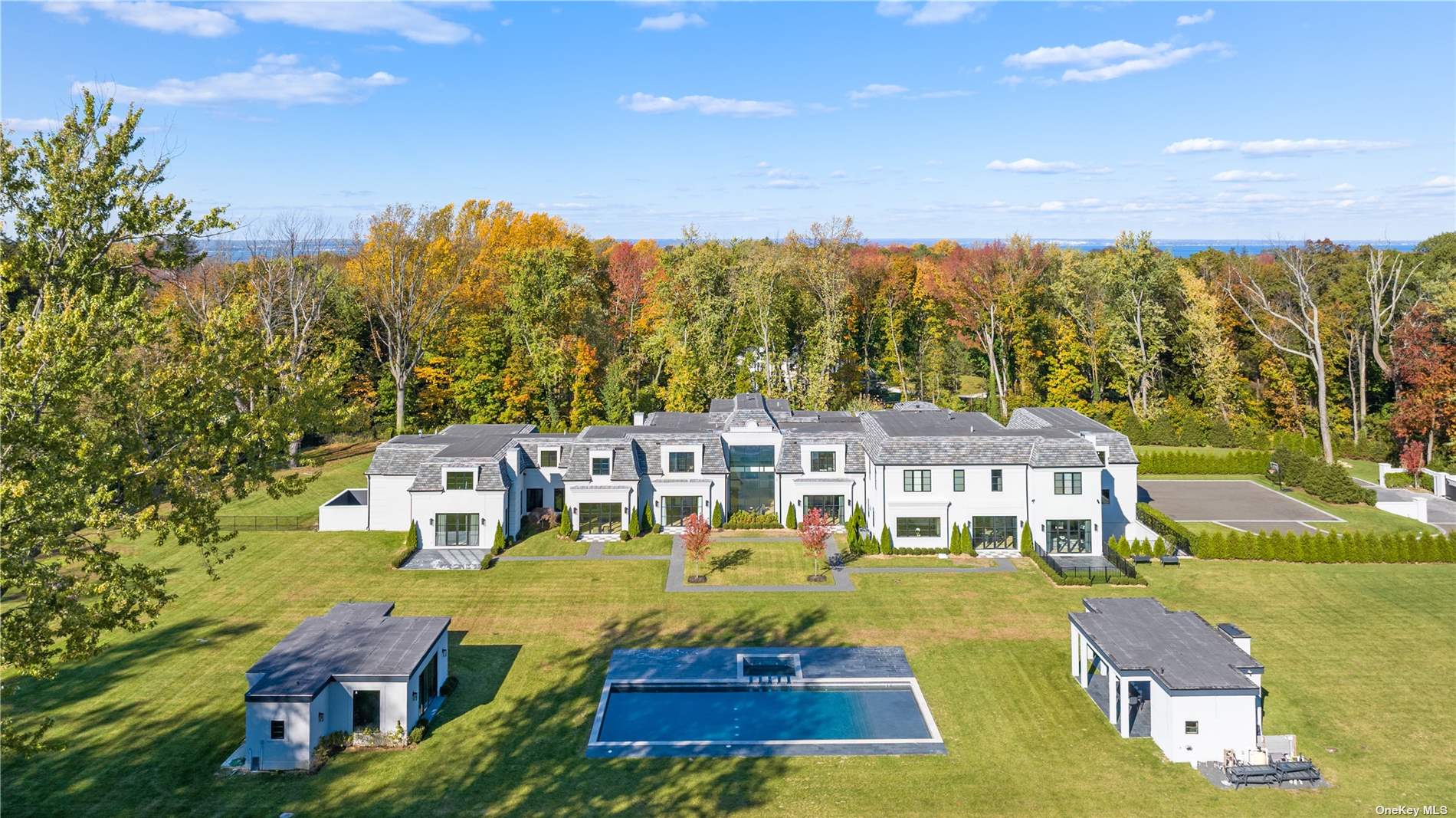 an aerial view of residential houses with yard