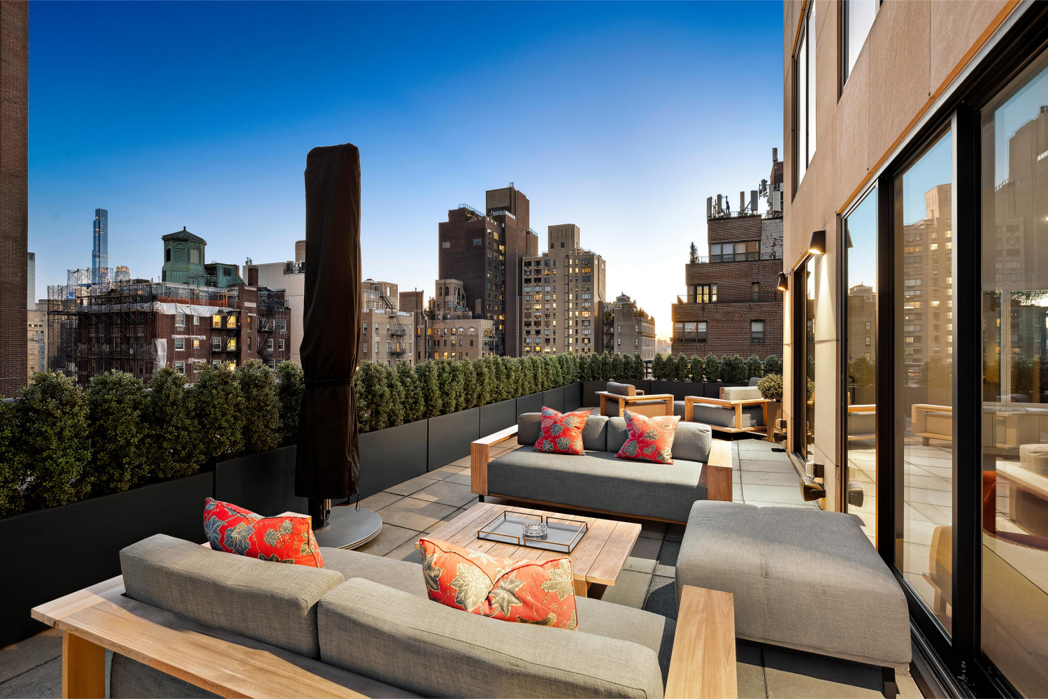 a outdoor living space with furniture and city view