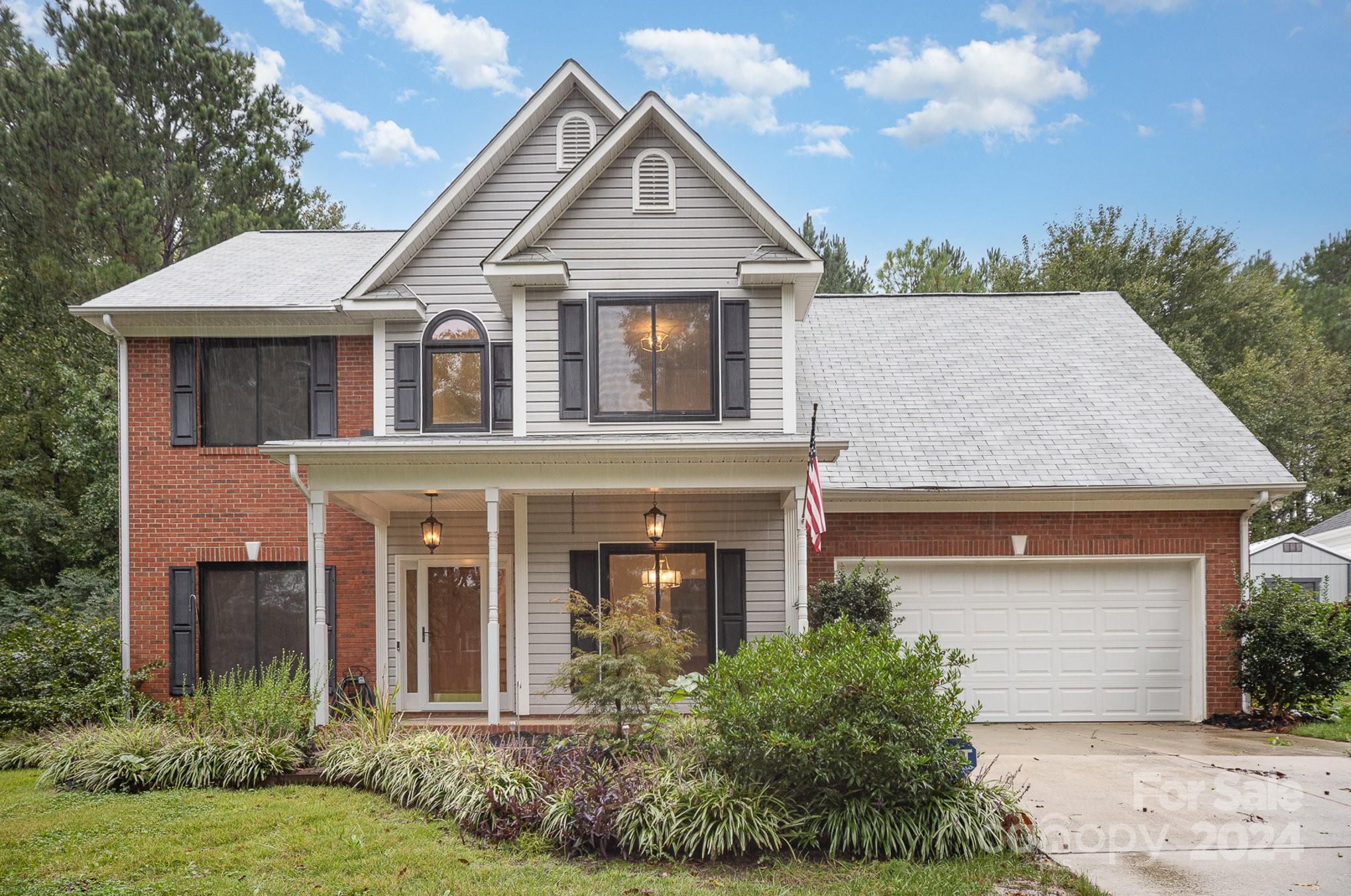 front view of a house with a yard