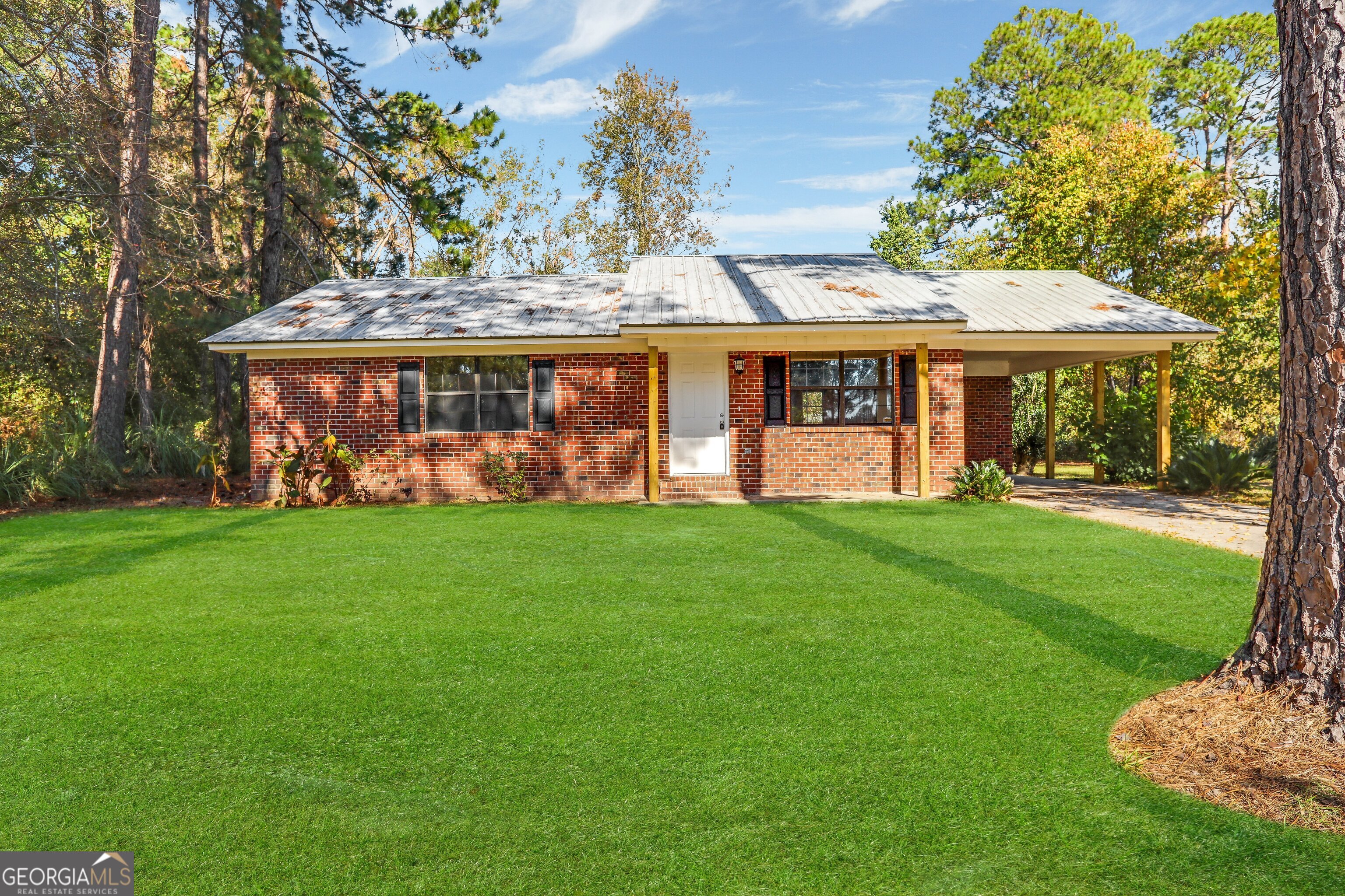 front view of a house with a yard