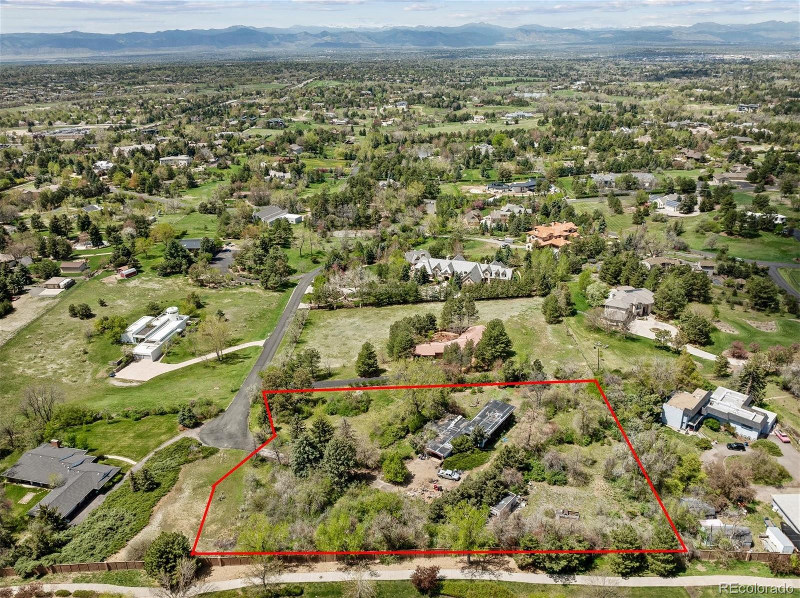 an aerial view of a houses with a yard