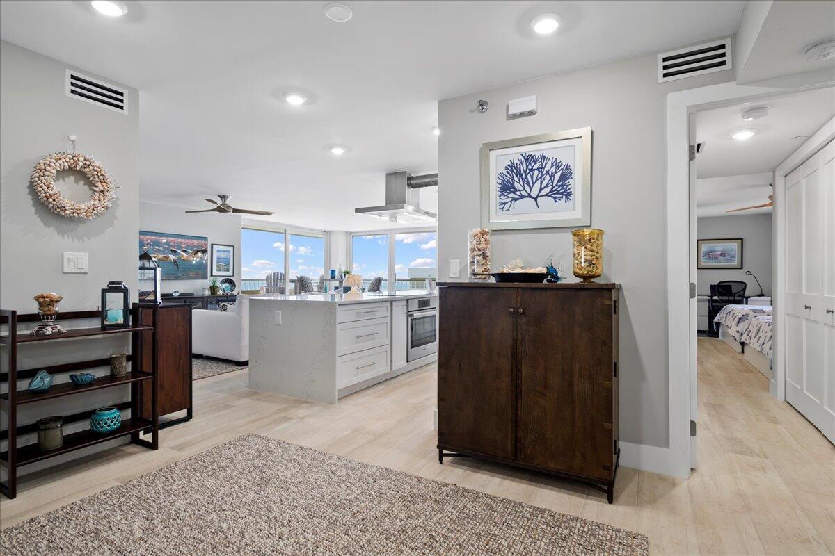 a kitchen with a refrigerator and a sink