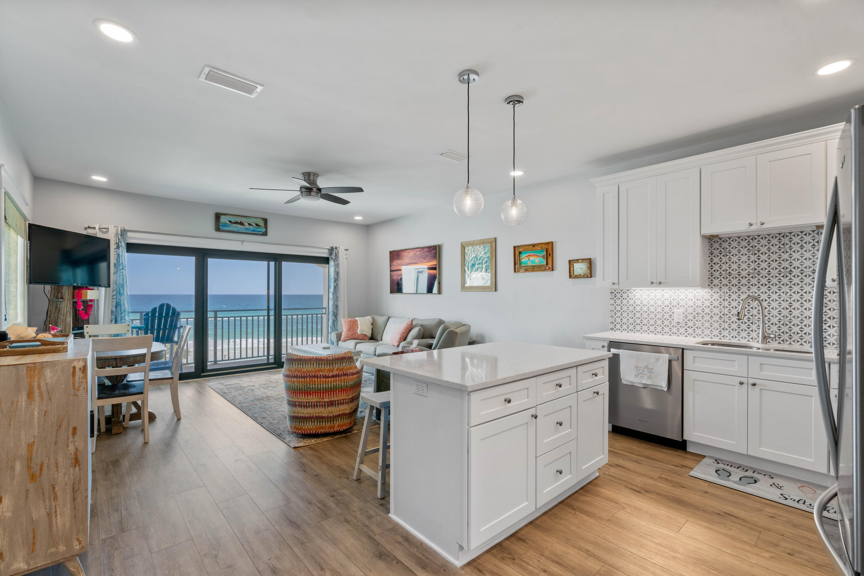 a kitchen with stainless steel appliances granite countertop a lot of counter space and wooden floors