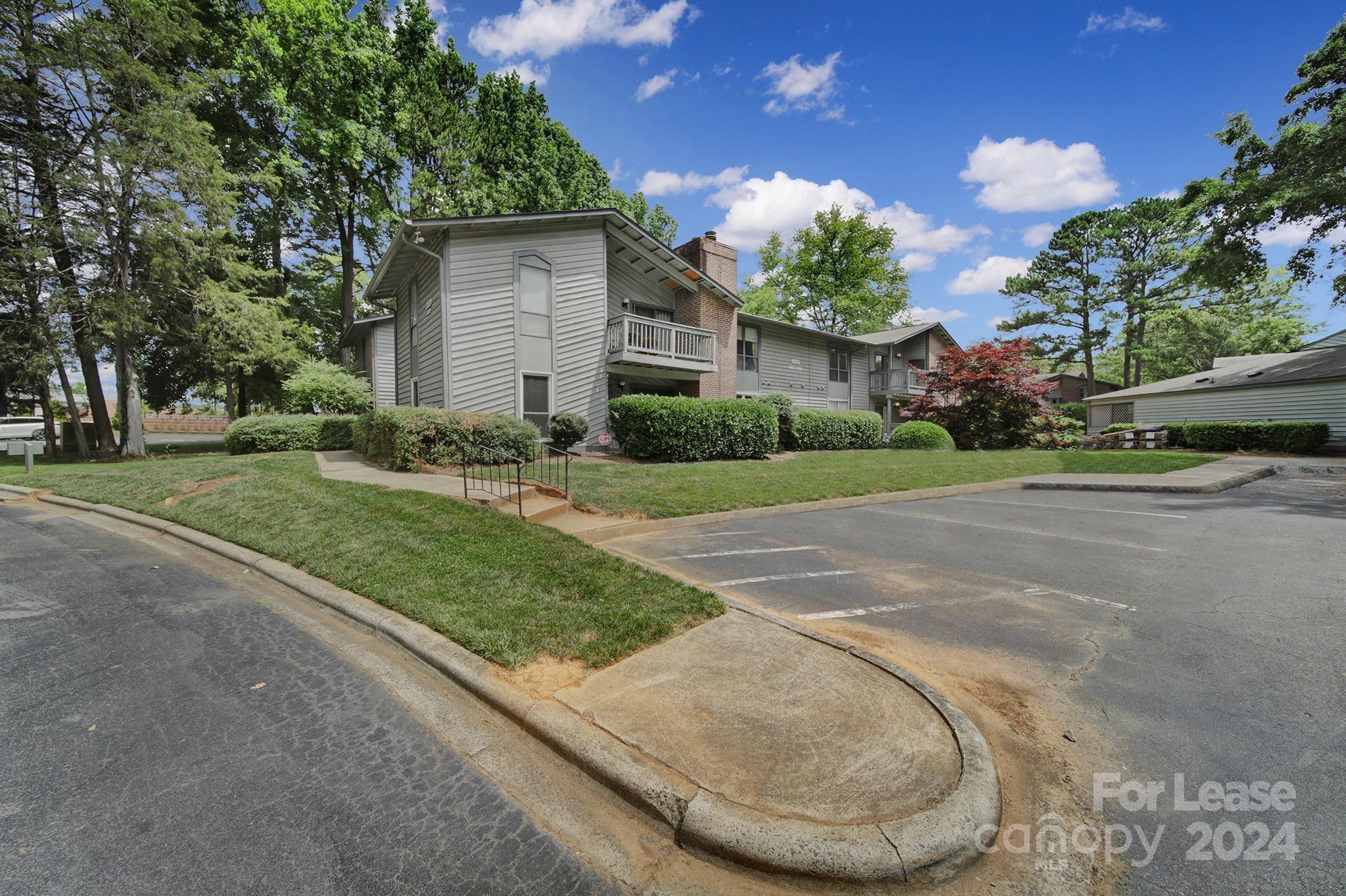 a view of a house with a yard and garage