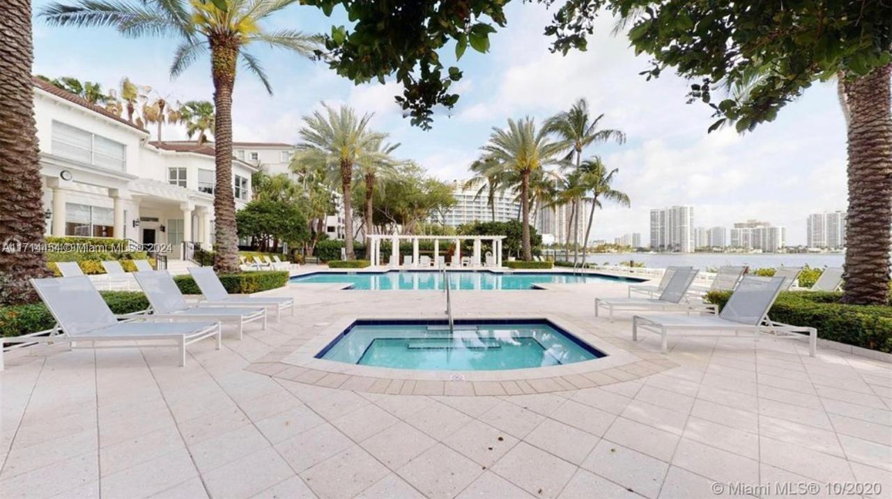 a view of a swimming pool with a lounge chairs