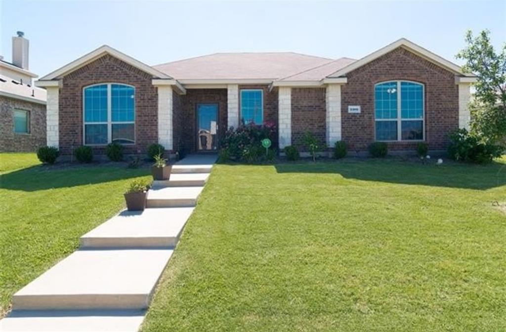 a front view of a house with yard