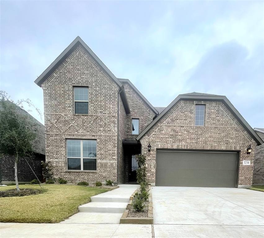 a front view of a house with yard