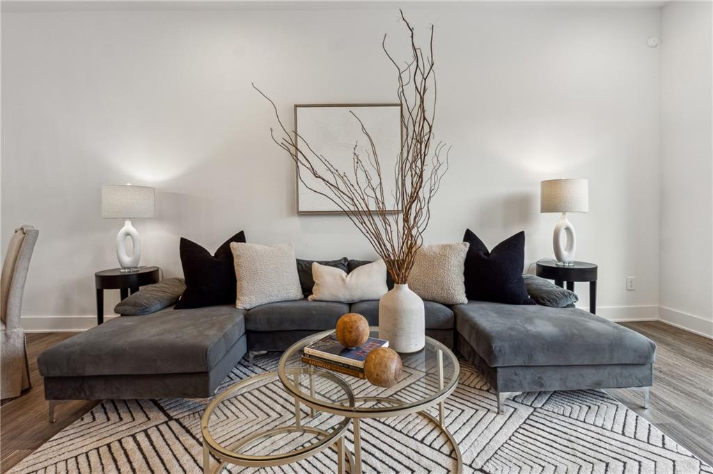 a living room with furniture and a rug