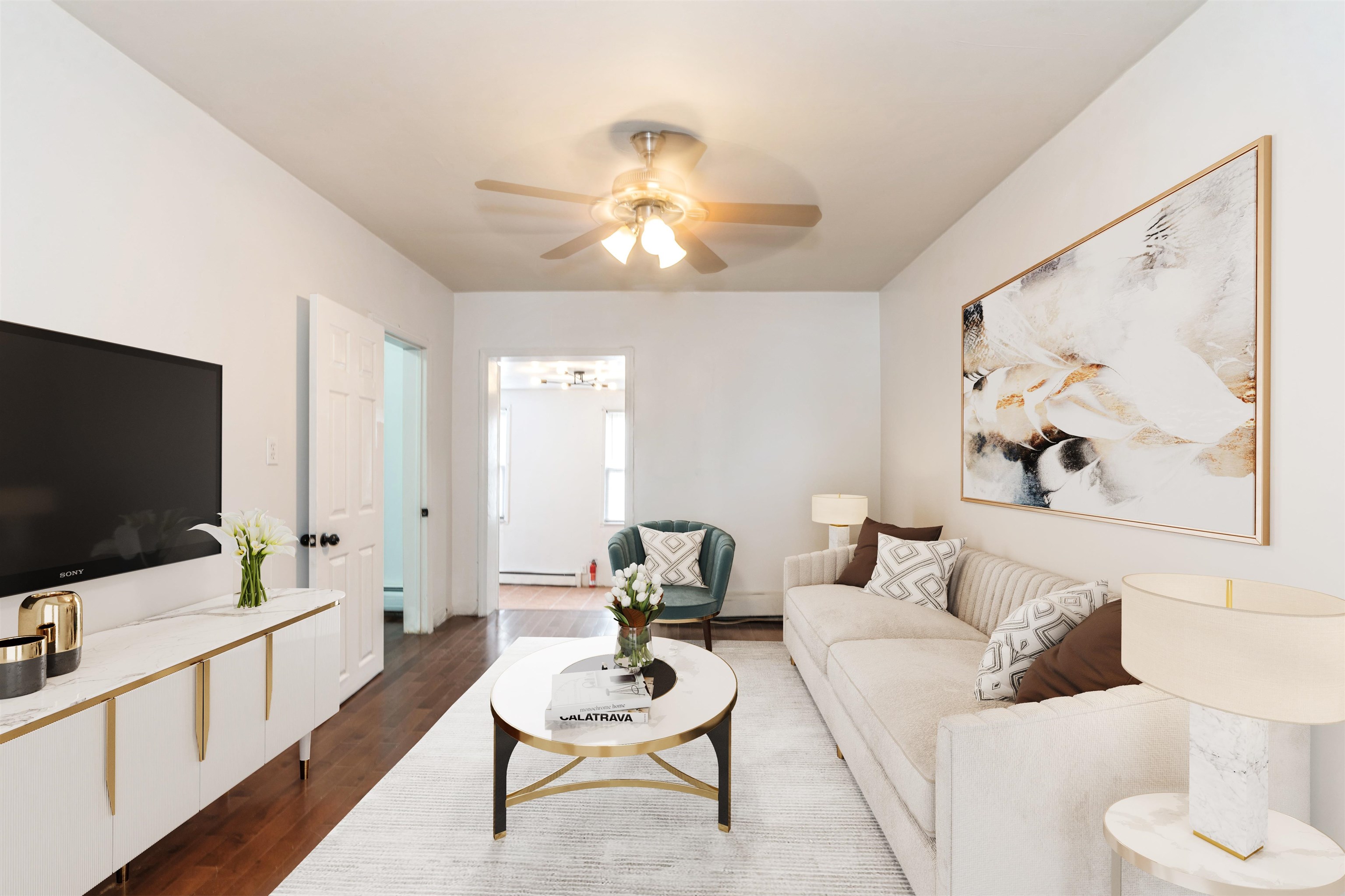 a living room with furniture and a flat screen tv