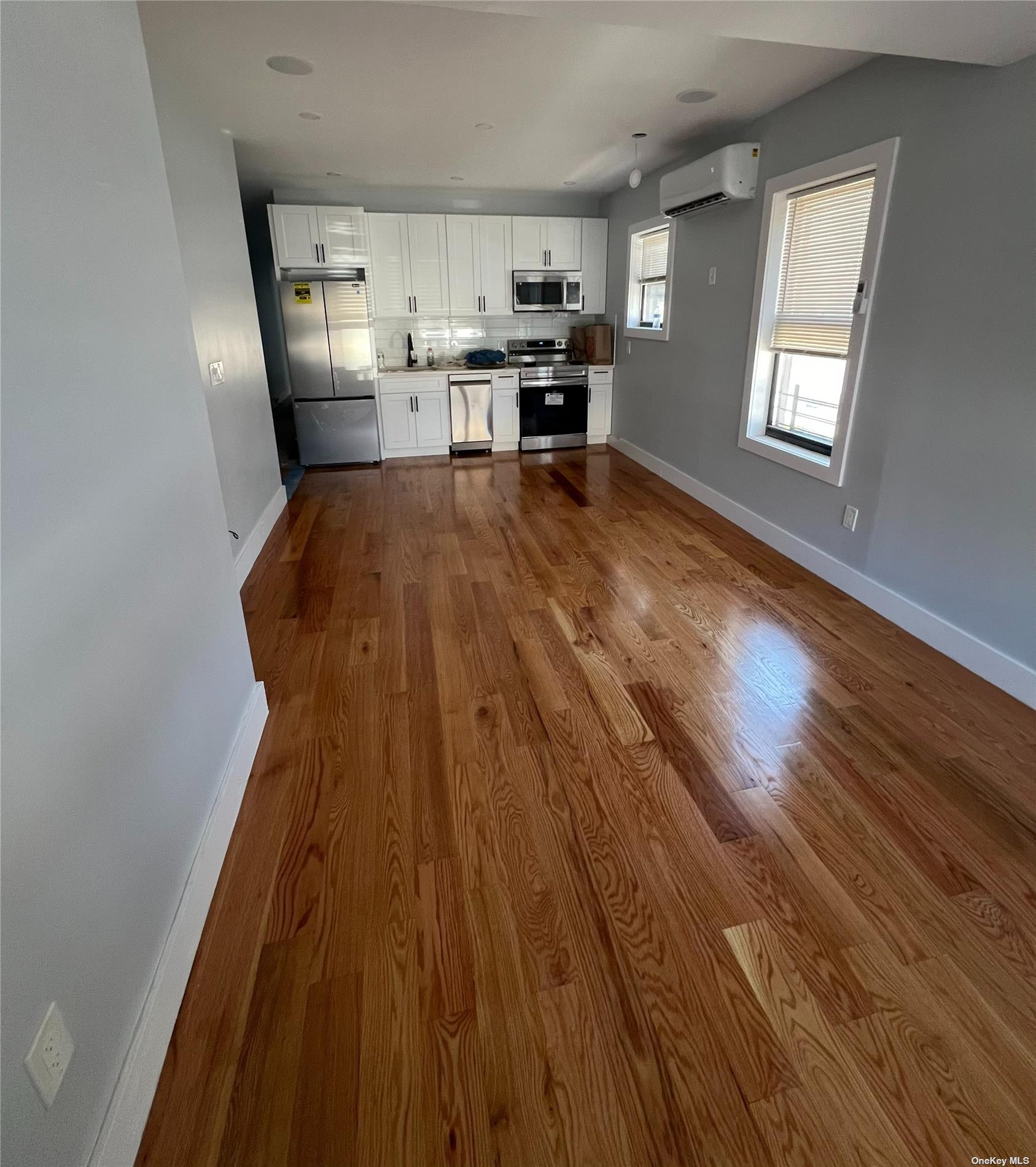 a view of kitchen and wooden floor