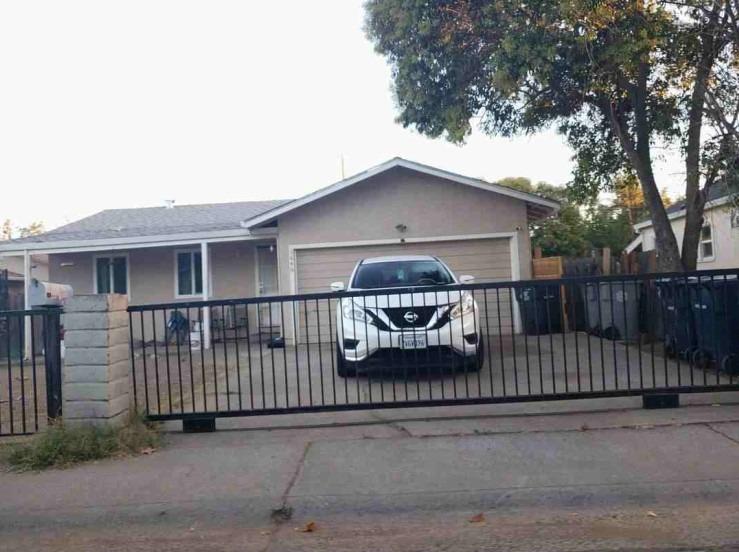 a front view of a house with parking space