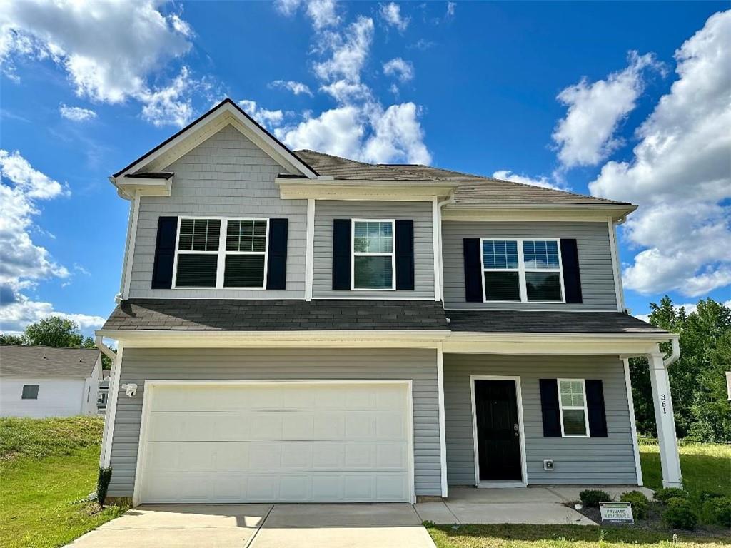 a front view of a house with a garage