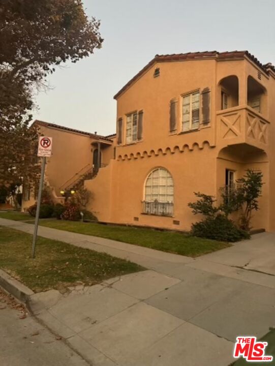 a view of a street with big house