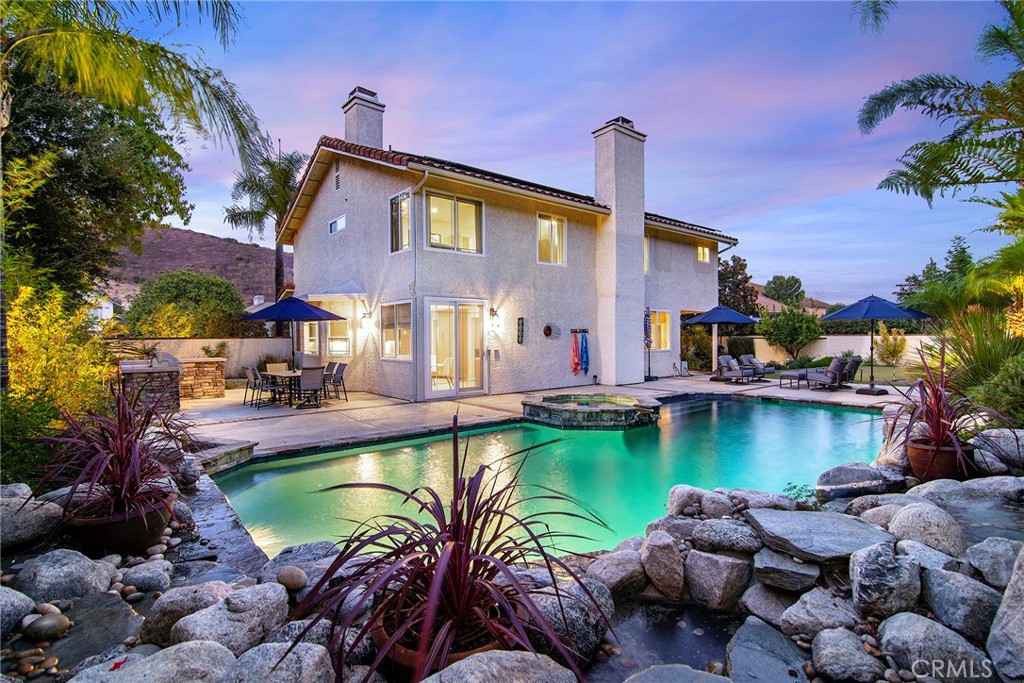 a view of a swimming pool with a patio