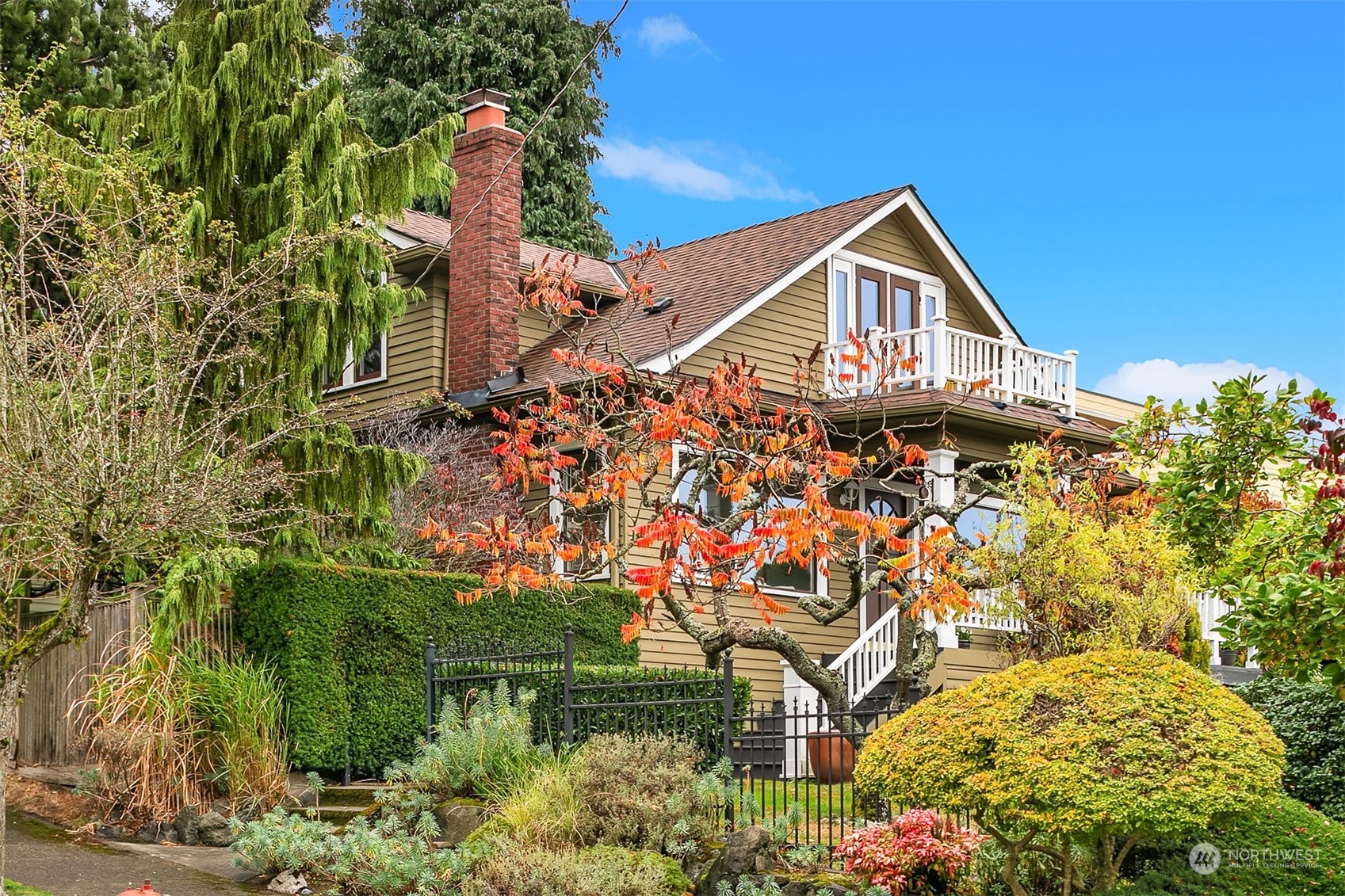 a aerial view of a house with a yard and potted plants