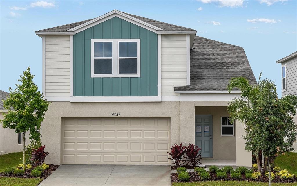 a front view of a house with a garage