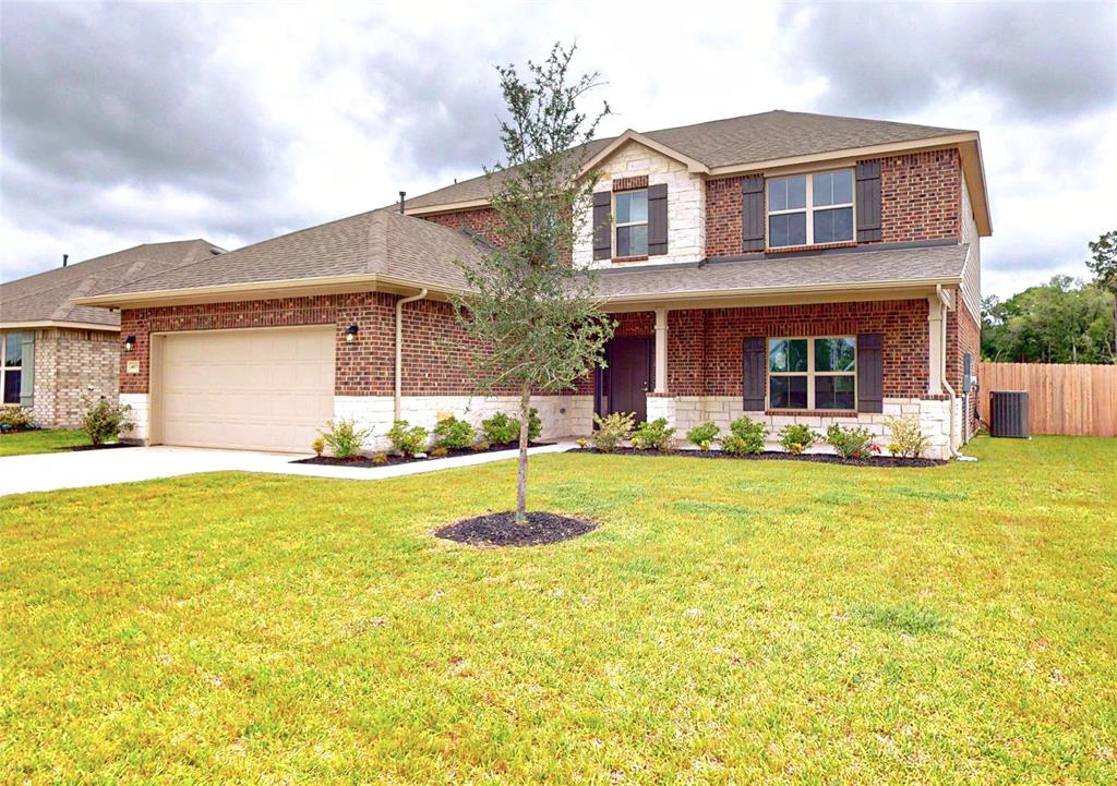 a front view of house with yard and swimming pool