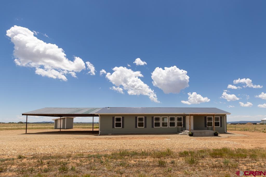 a view of a house with a big yard