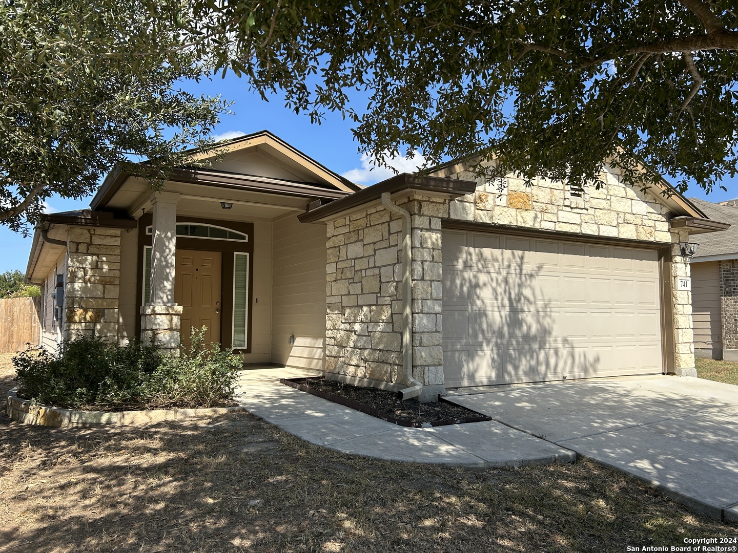 a front view of a house with yard