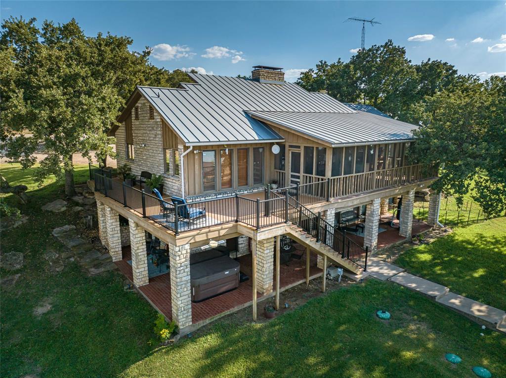 an aerial view of a house with a yard