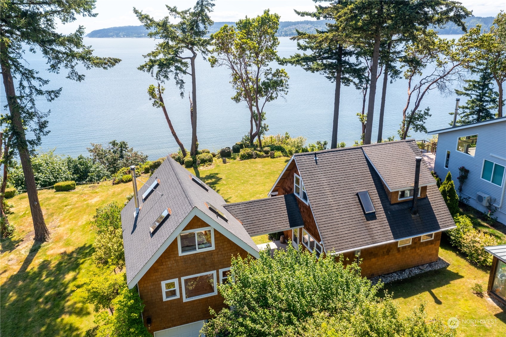 an aerial view of residential house with outdoor space and swimming pool