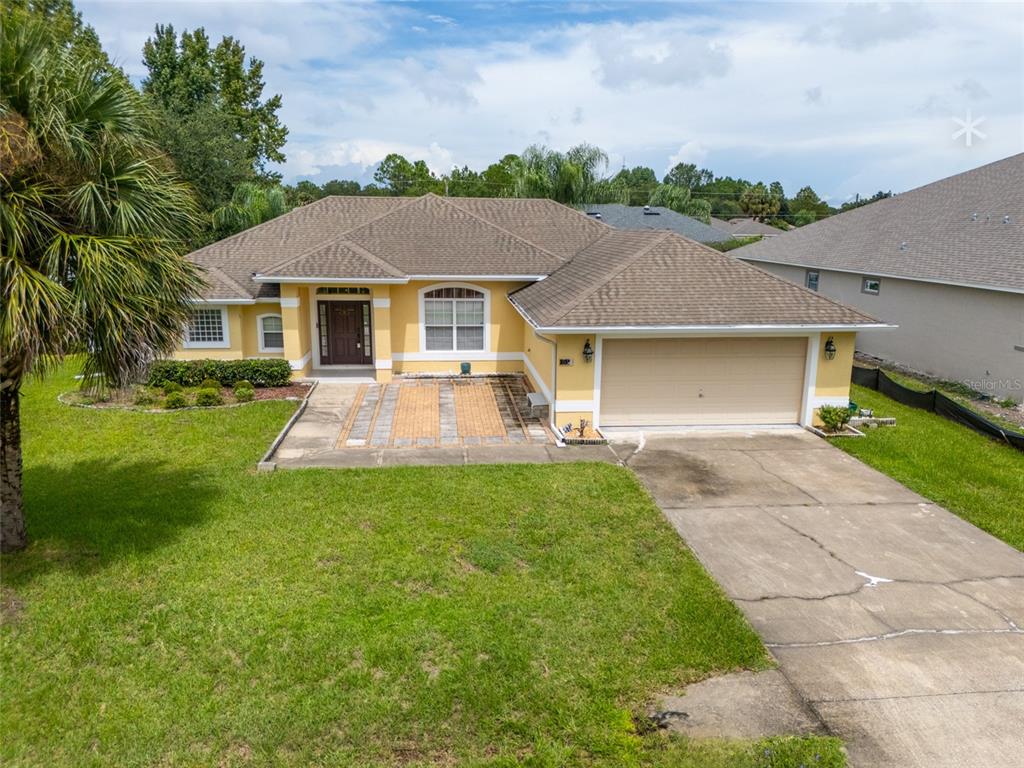 a front view of a house with yard