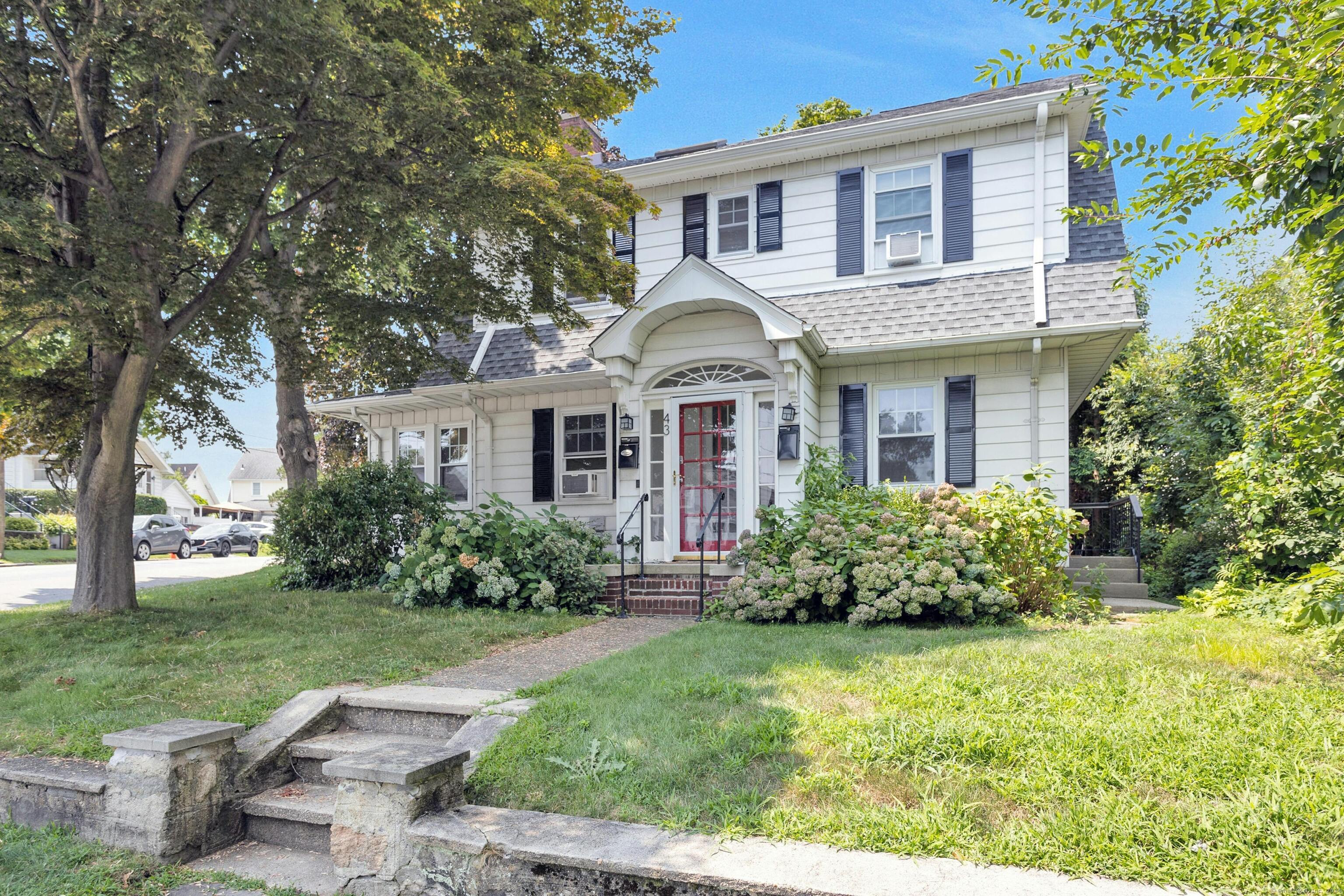 front view of a house with a yard