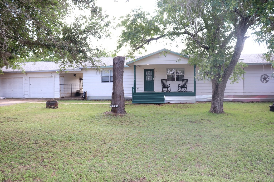 a front view of house with yard and entertaining space