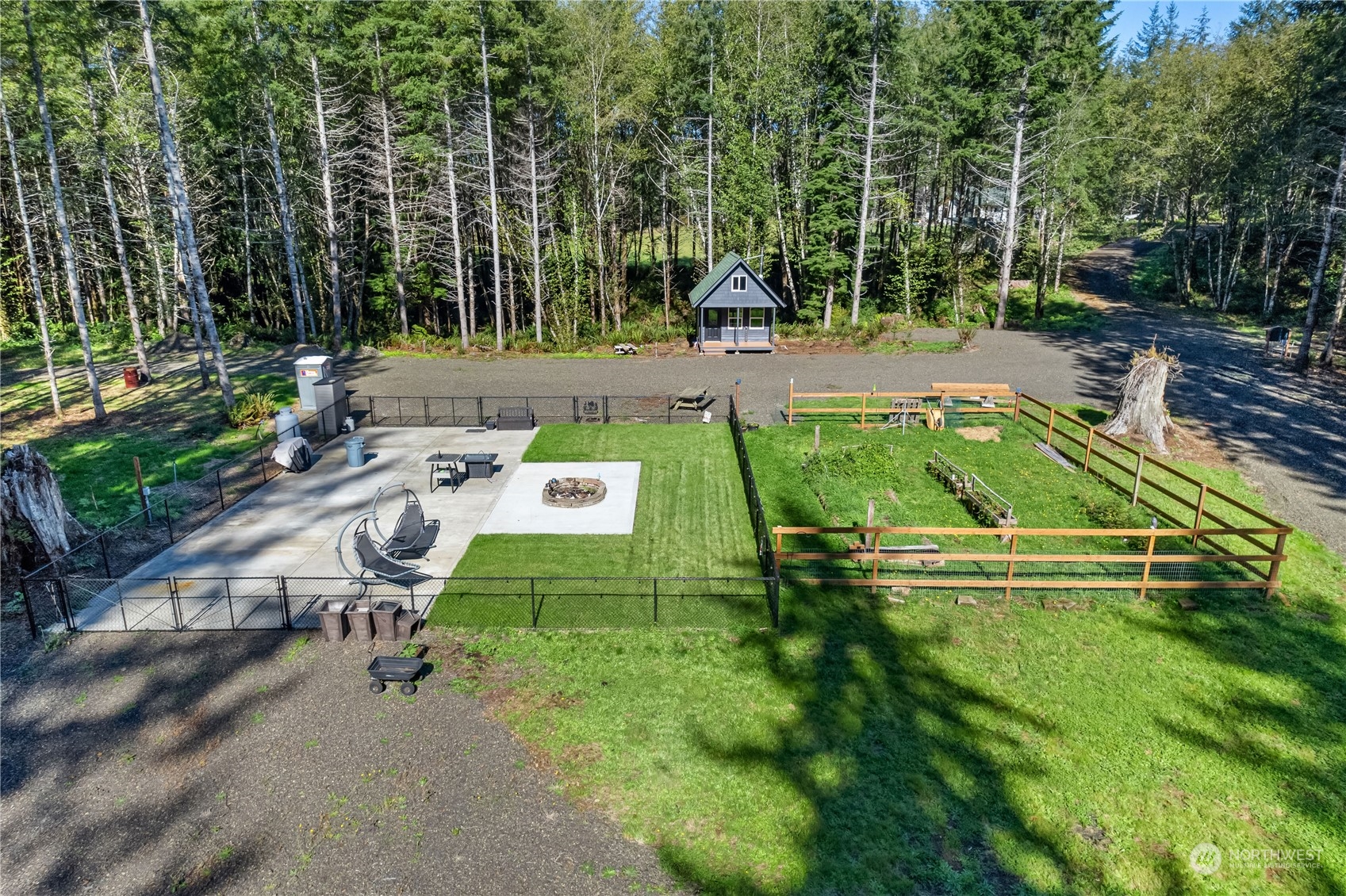 an aerial view of a park with large trees