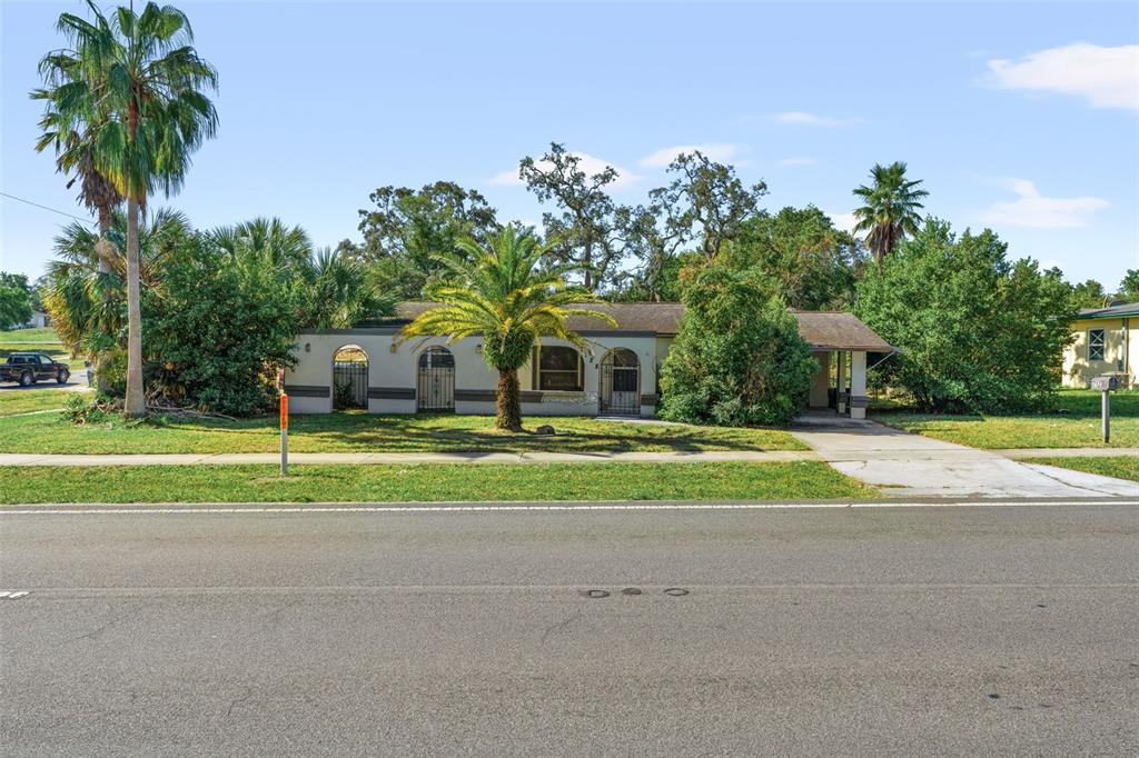 a house with palm tree in the background