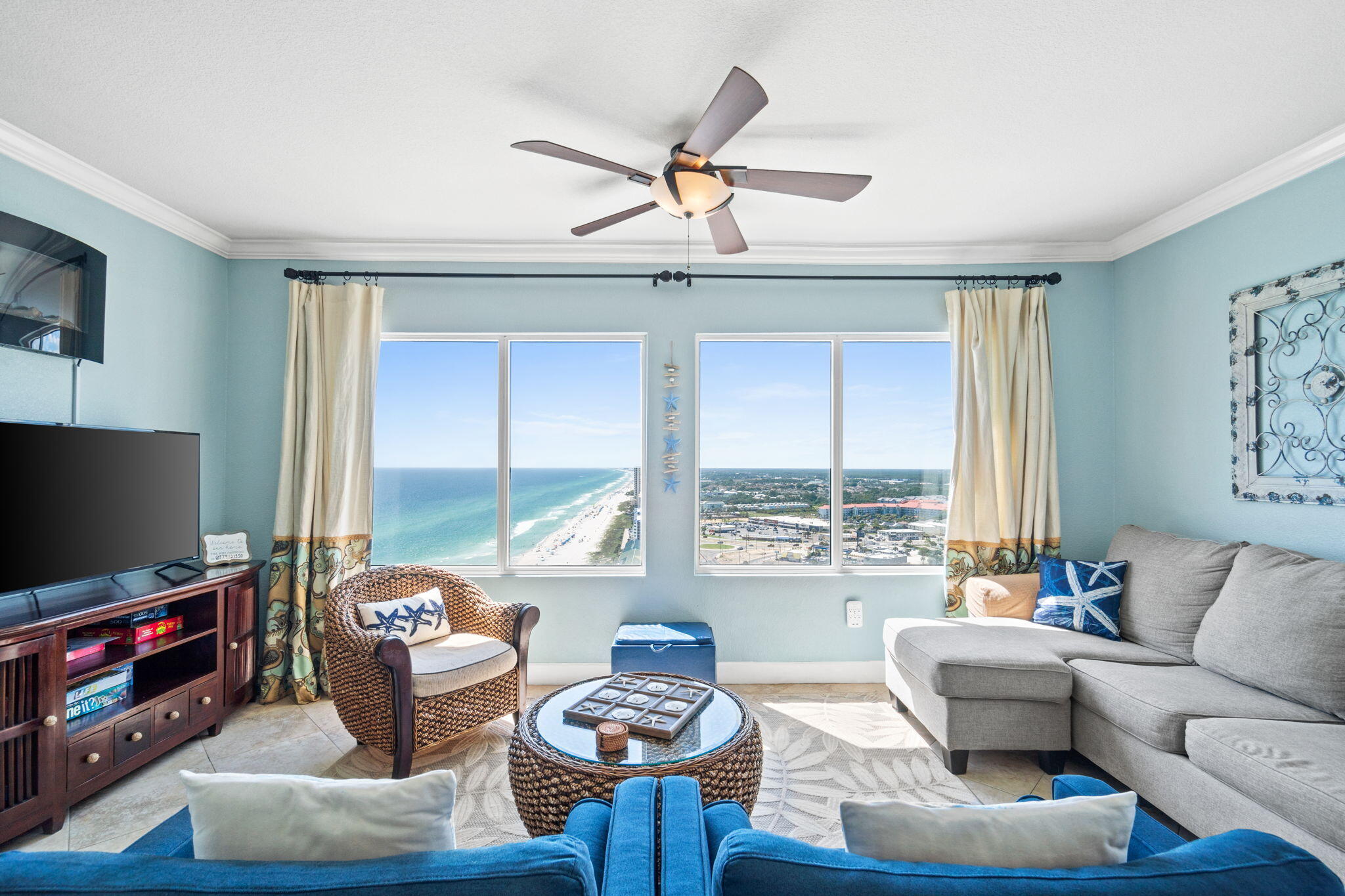 a living room with furniture and a flat screen tv