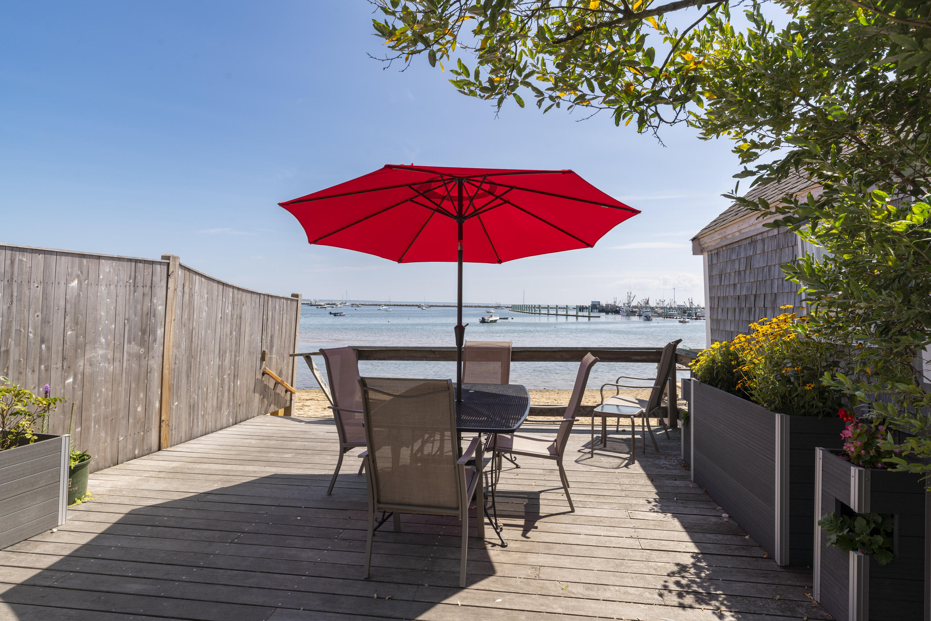 a view of balcony with outdoor seating and wooden floor