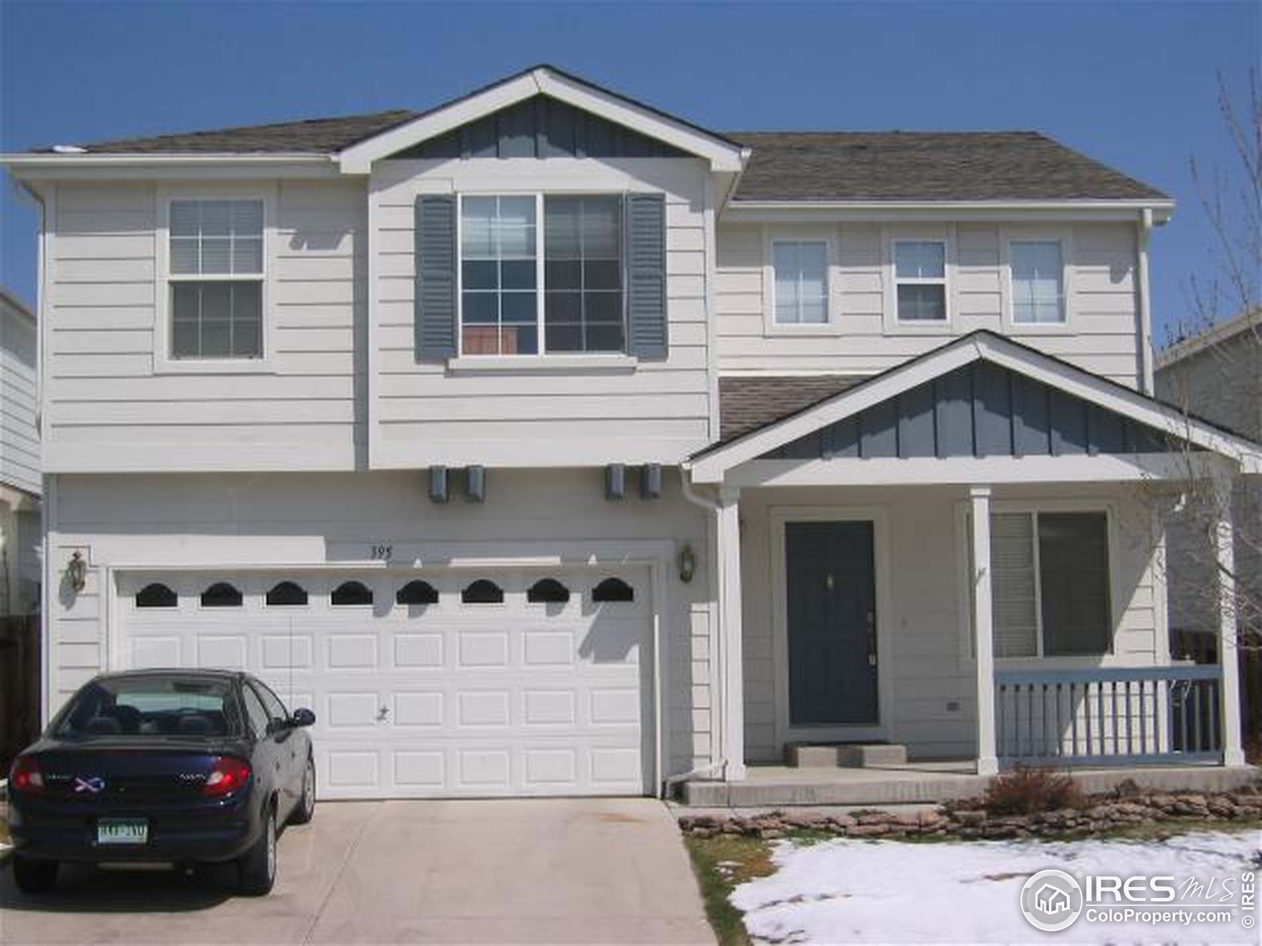 a front view of a house with parking space