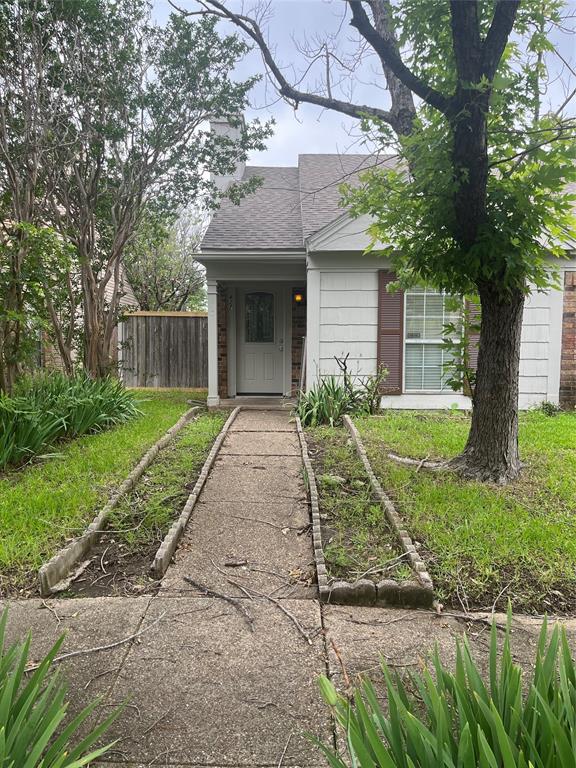 a front view of a house with yard