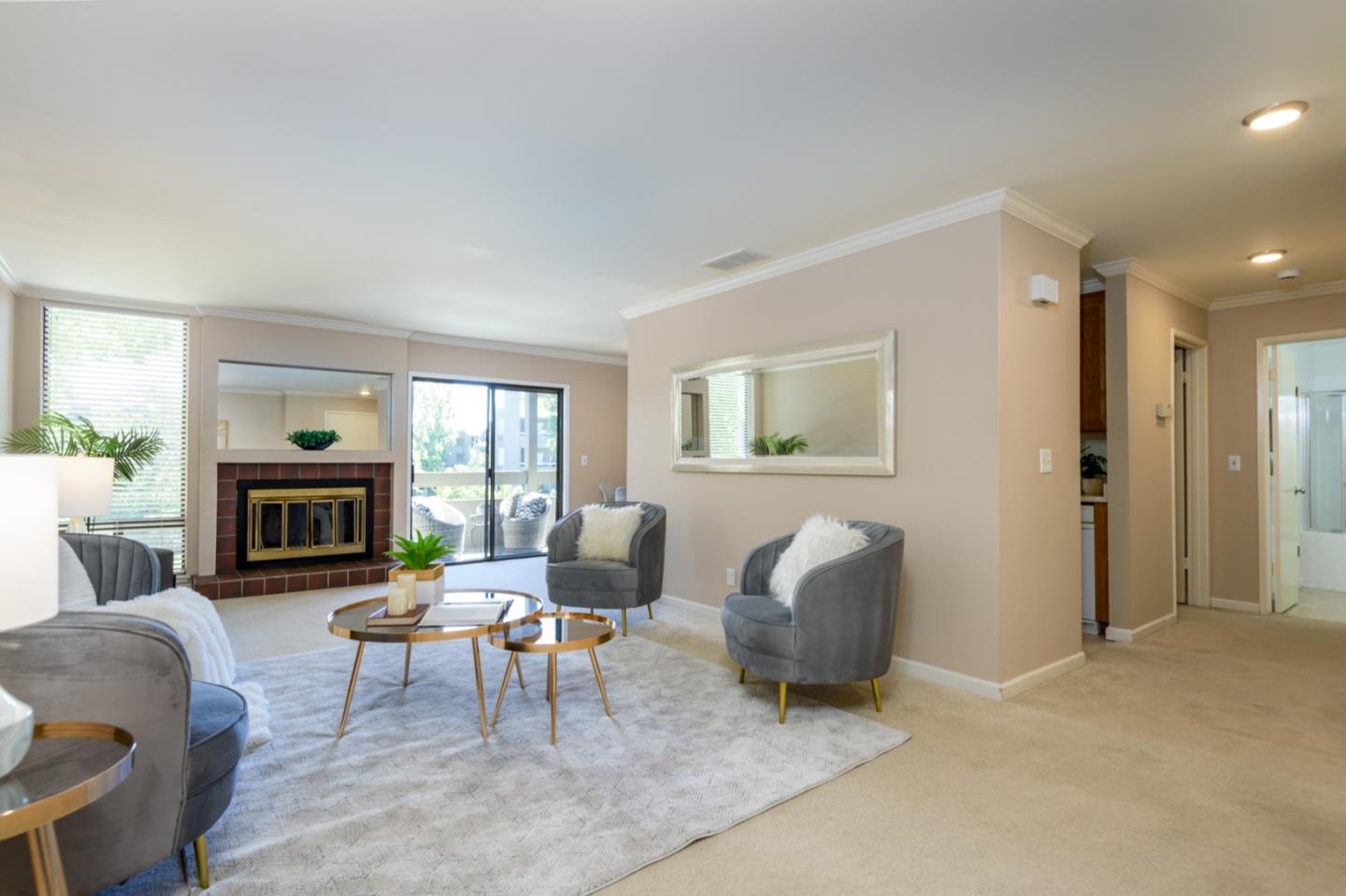 a living room with furniture and a fireplace