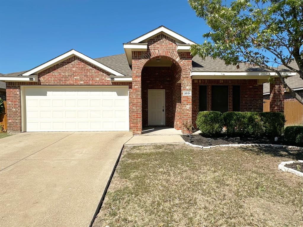 a view of a house with a yard and garage