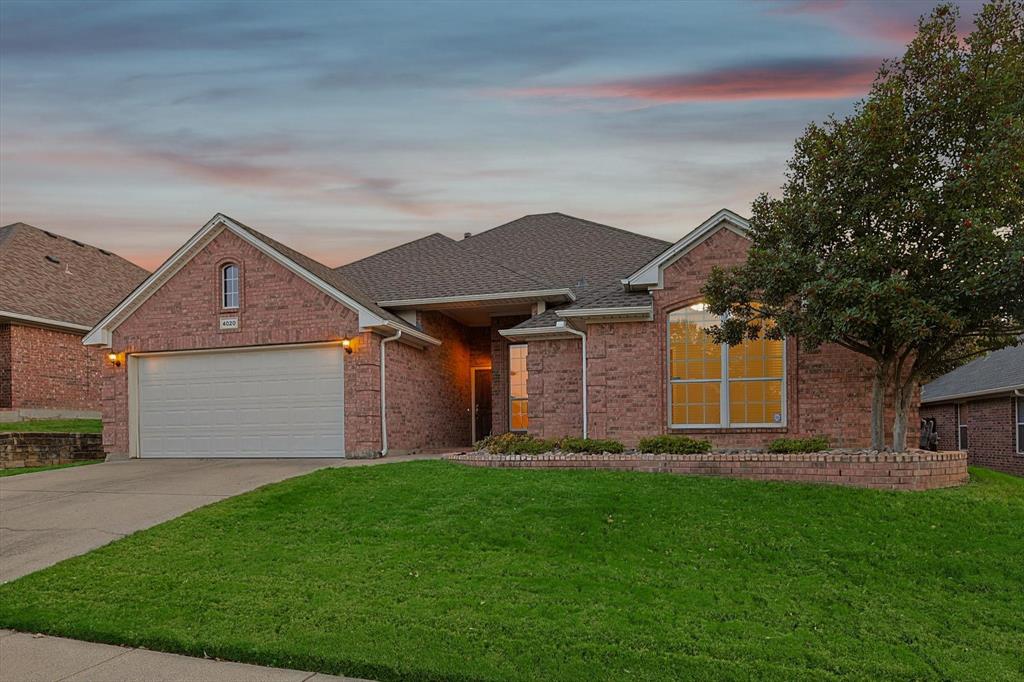 Ranch-style house featuring a yard