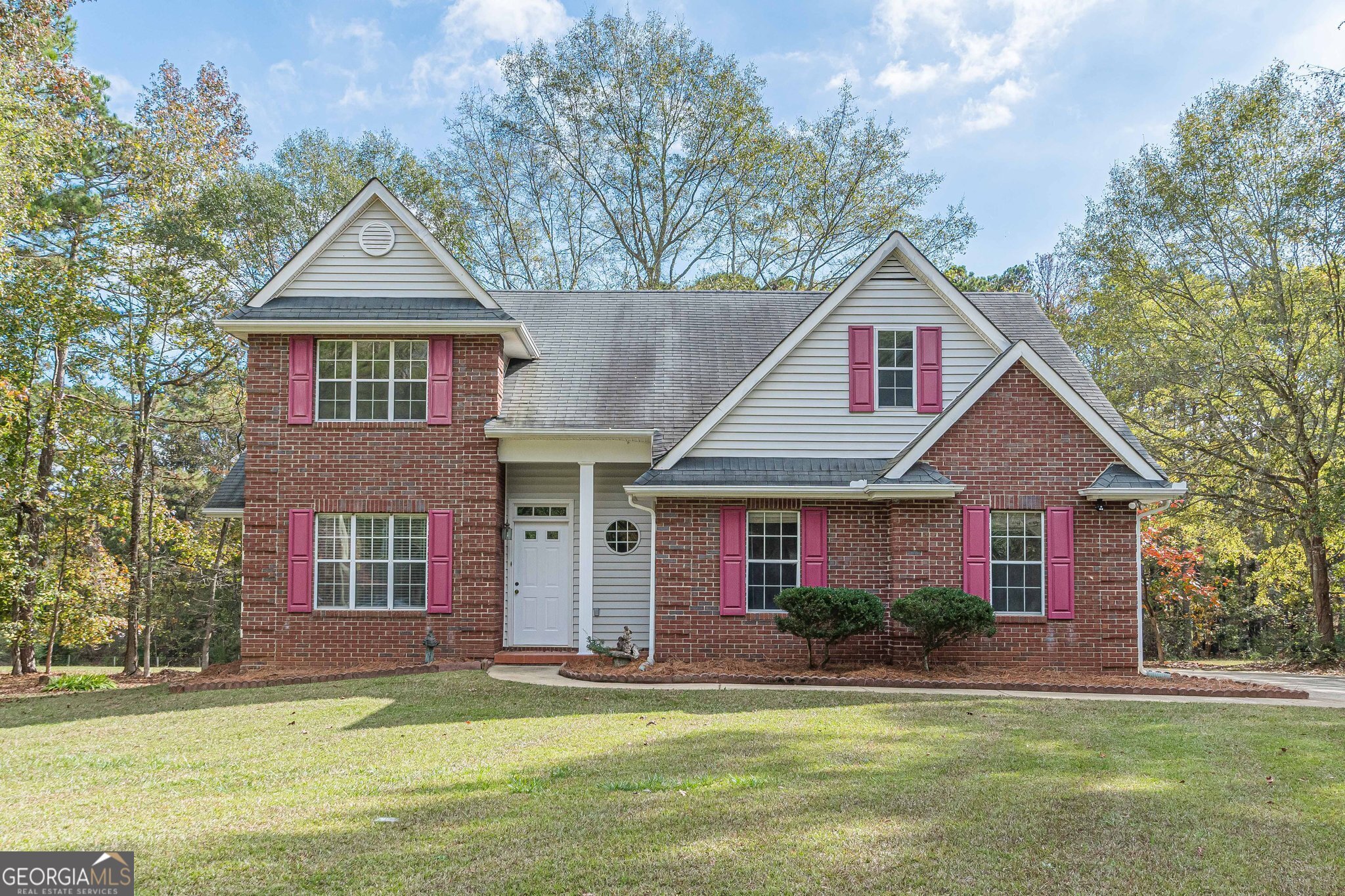 a front view of a house with a yard